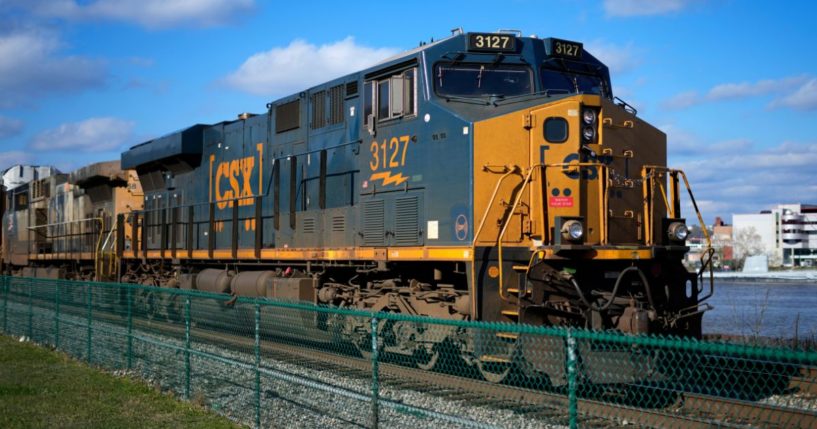 a CSX freight train sittting on a siding