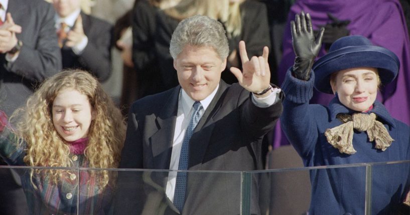 President Bill Clinton, his daughter Chelsea, left, and wife Hillary Rodham Clinton, right, wave to the crowd on inauguration day, Jan. 20, 1993, in Washington.