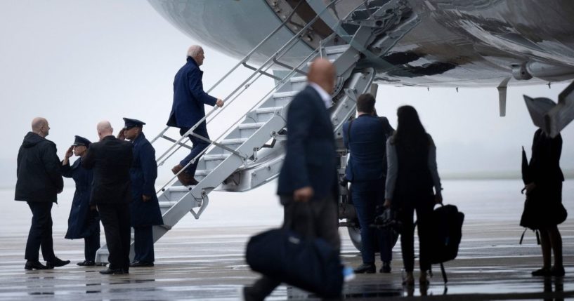 President Joe Biden climbs the stairs of Air Force One on Joint Base Andrews in Maryland on Tuesday.