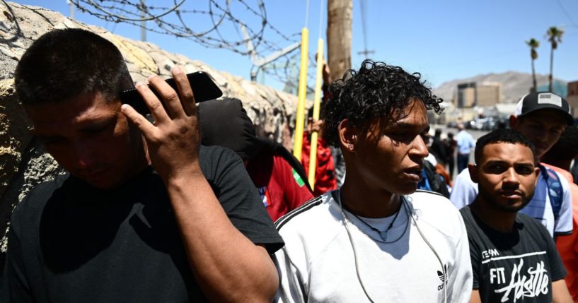 Illegal immigrants from Venezuela wait to turn themselves in for processing to U.S. Border Patrol agents after crossing from Mexico into El Paso, Texas, on May 9.