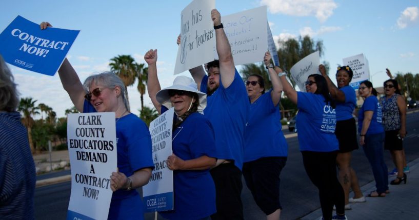 Teachers and members of the Clark County Education Association rally in support of a new contract for teachers Wednesday in Las Vegas. School district officials in Las Vegas asked a judge consider a motion to put an end to what they claim is a coordinated union campaign of teachers calling in sick amid their bitter contract battle.