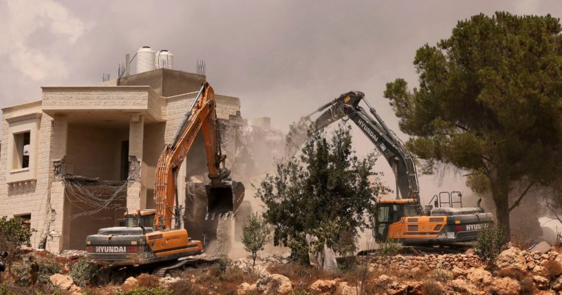 Bulldozers demolish a Palestinian house built without a permit from the Israeli authorities in Area C on Aug. 29.