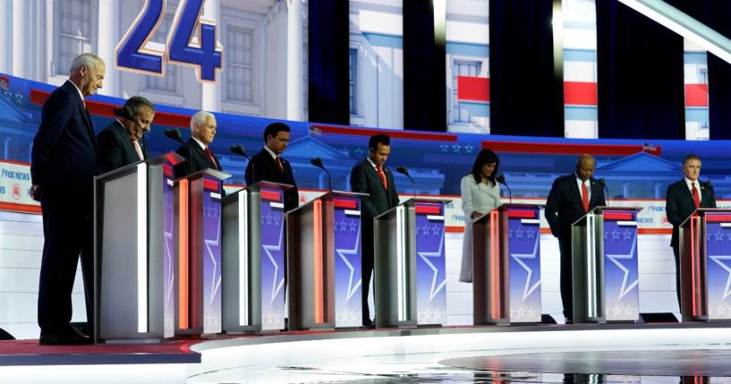 Republican primary candidates pray on stage before the first Republican primary debates hosted by Fox News in Milwaukee, Wisconsin, on Aug. 23. Seven Republican presidential candidates will participate in the second primary debates at the Ronald Reagan Presidential Library in Simi Valley, California, on Wednesday.