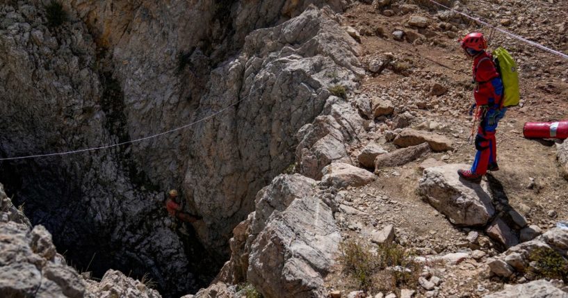 European Cave Rescue Association members go down into the Morca cave during a rescue operation near Anamur, south Turkey, on Friday.