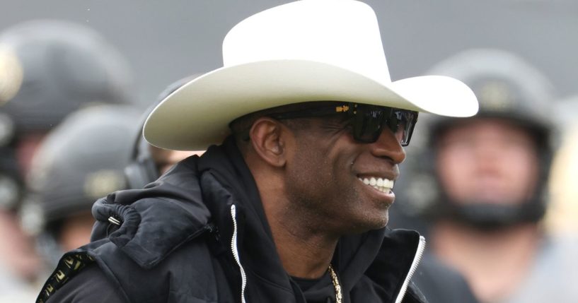 Head coach Deion Sanders of the Colorado Buffaloes watches as his team warms up prior to their spring game at Folsom Field on April 22 in Boulder, Colorado.