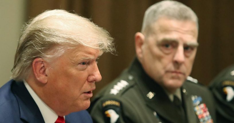 Then-President Donald Trump speaks as Joint Chiefs of Staff Chairman, Army Gen. Mark Milley looks on after getting a briefing from senior military leaders in the Cabinet Room at the White House on Oct. 7, 2019, in Washington, D.C.