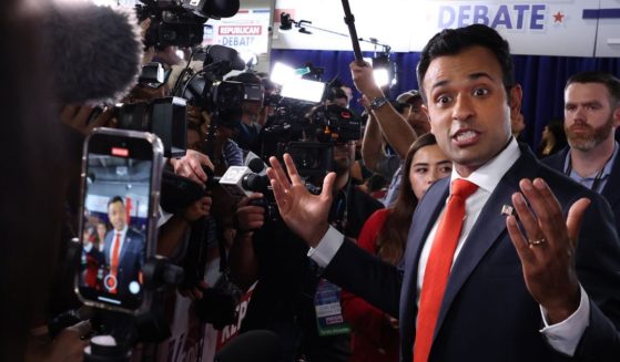 Republican presidential candidate, Vivek Ramaswamy talks to members of the media in the spin room following the first debate of the GOP primary season hosted by FOX News at the Fiserv Forum on August 23, in Milwaukee, Wisconsin. Ramaswamy recently stated that he would make Epstein’s client list public.