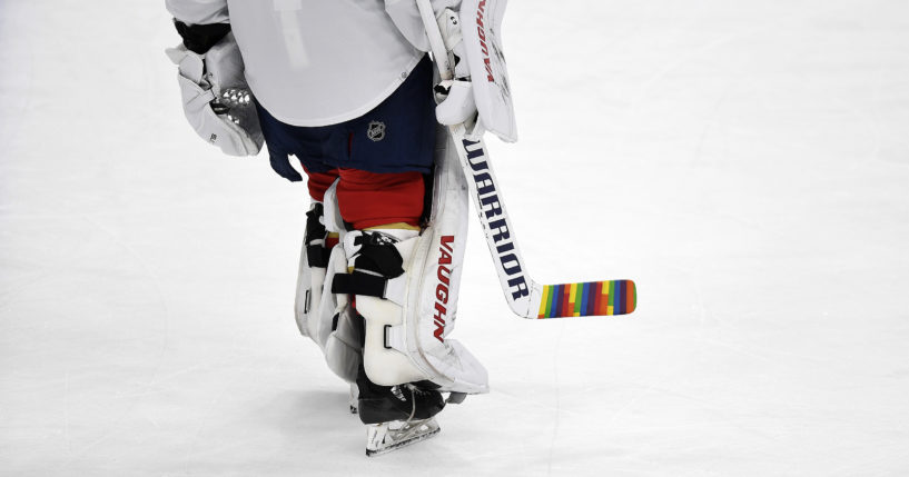 Florida Panthers goaltender Alex Lyon warms up with a colorful hockey stick during "pride" night before playing the Toronto Maple Leafs in Sunrise, Florida, on March 23. Last week the NHL sent memos to teams informing them of protocols for themed celebrations for the upcoming season, including the banning of "pride" tape during "pride" nights.