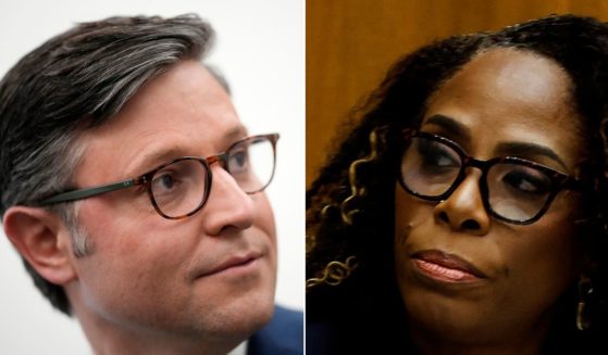 At left, Rep. Mike Johnson leaves a House Republican conference meeting in the Longworth House Office Building on Capitol Hill in Washington Oct. 24. At right, Democratic Del. Stacey Plaskett of the Virgin Islands speaks during a hearing of the House Judiciary subcommittee on the weaponization of the federal government on Capitol Hill on July 20.