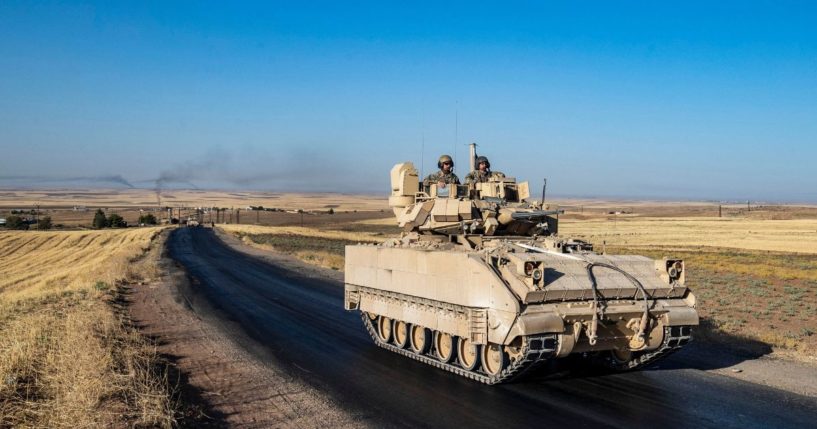 U.S. soldiers patrol the countryside in Syria's northeastern Hasakeh province on July 17.