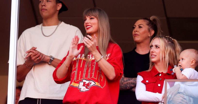 Taylor Swift, center, reacts during a game between the Los Angeles Chargers and Kansas City Chiefs at Arrowhead Stadium on Sunday in Kansas City, Missouri.