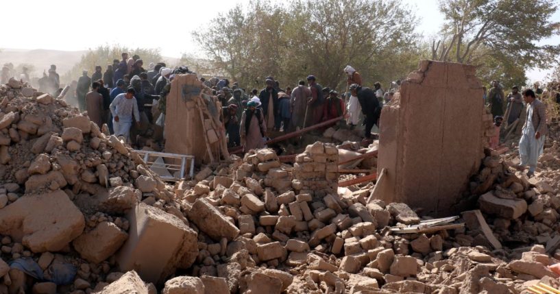 Afghan men search for victims after an earthquake in Zenda Jan district in Herat province, of western Afghanistan, Sunday.