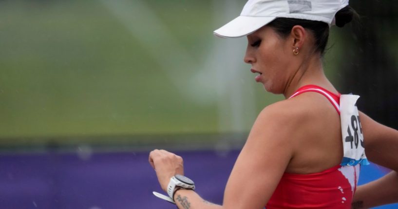 Peru's Gabriela Kimberly Garcia looks at the watch during the women's 20km race walk final at the Pan American Games in Santiago, Chile, on Sunday.