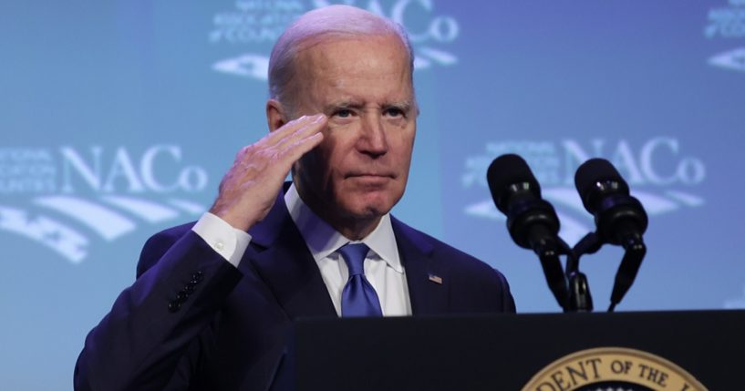 President Joe Biden salutes during an address at the National Association of Counties legislative conference at the Washington Hilton Hotel in February in Washington.