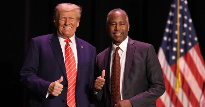 Former President Donald Trump, left, and former Housing and Urban Development Secretary Ben Carson, right, give a thumbs up for the cameras during a rally Sunday in Sioux City, Iowa. Carson has endorsed Trump as the GOP presidential nominee in 2024.