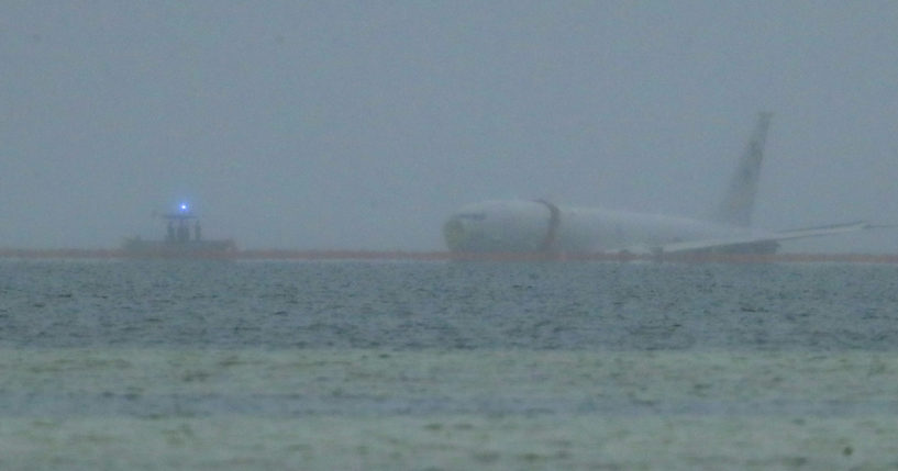 A U.S. Navy aircraft is seen in Kaneohe Bay in Hawaii on Monday. The plane overshot a runway and landed in the water.