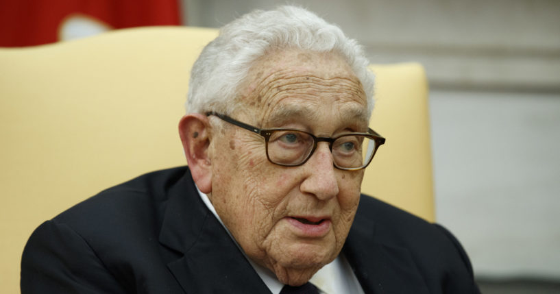 Former Secretary of State Henry Kissinger speaks during a meeting with then-President Donald Trump in the Oval Office of the White House in Washington on Oct. 10, 2017.