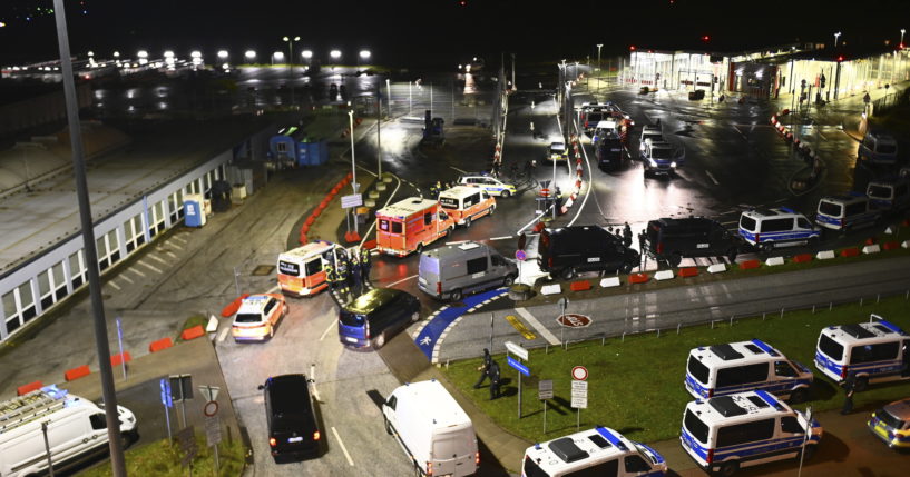 Police vehicles and ambulances arrive at the scene of a security breach at the Hamburg Airport Saturday in Hamburg, Germany.