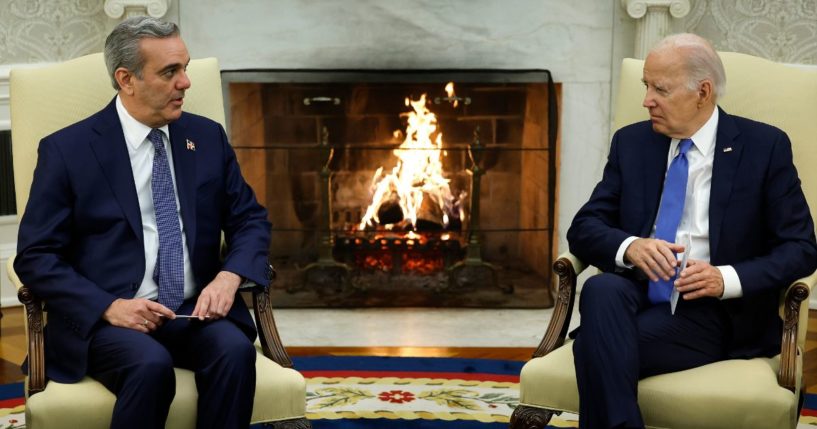 Dominican Republic President Luis Abinader, left, talks to President Joe Biden in the Oval Office of the White House in Washington on Thursday.