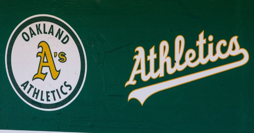 The Oakland Athletics logos are seen in the dugout before a game against the San Francisco Giants at Oakland Coliseum on July 22, 2018, in Oakland, California.