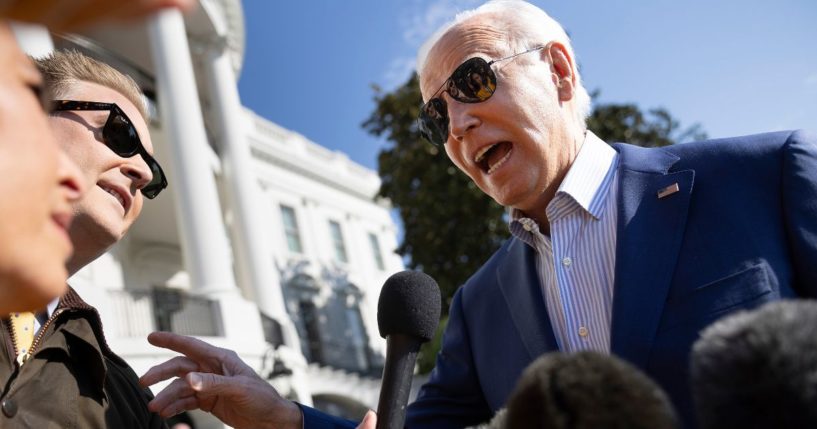 President Joe Biden, right, answers a question from Fox News correspondent Peter Doocy, left, while leaving the White House on Thursday.