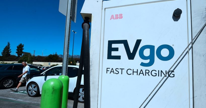 An electric vehicle is plugged in for a charge in a 2018 file photo from Duarte, California.