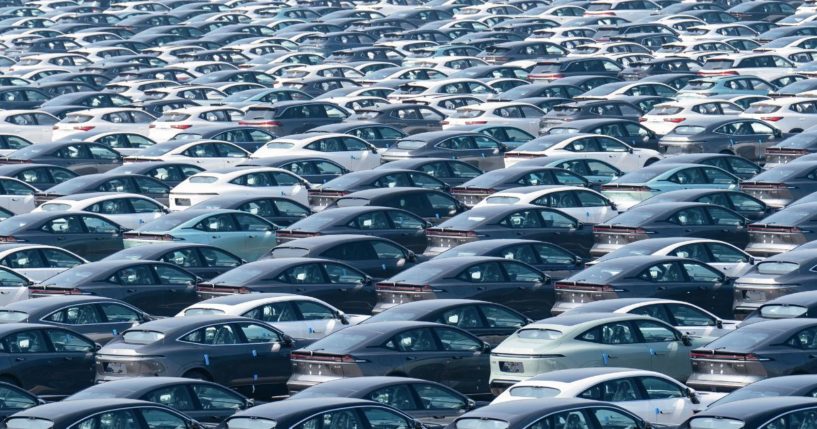 A fleet of new electric vehicles is photographed at a distribution center of Changan Automobile in Chongqing, China, on Oct. 15. Several electric vehicle companies have reduced prices on their vehicles due to lack of demand.