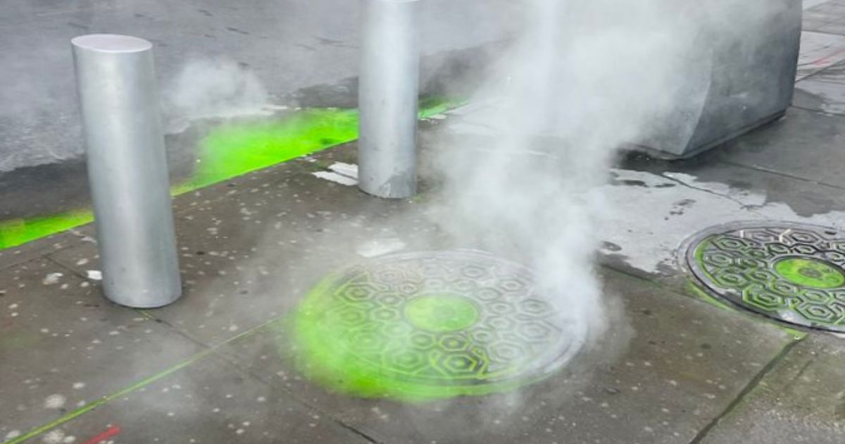 Green liguid is seen on a New York City sidewalk near the World Trade Center.