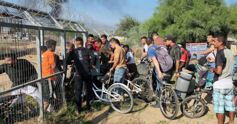 Associated Press freelancer Hassan Eslaiah captured this photo of Palestinians from the Gaza Strip entering Kibbutz Kfar Azza on Oct. 7.