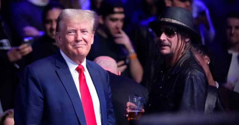 Former President Donald Trump, left, stands with Kid Rock at the UFC 295 mixed martial arts event in New York on Saturday.