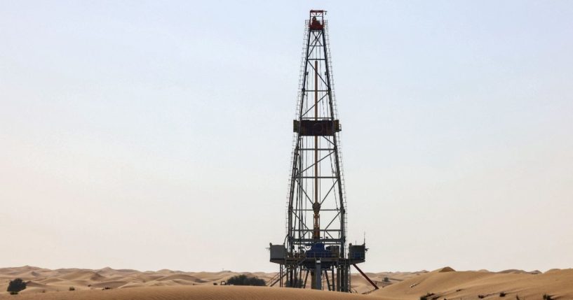 An oil drill pump is pictured amidst the sand dunes in the desert of the Gulf emirate of Dubai in the United Arab Emirates on Aug. 30, 2022.