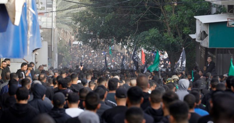 Palestinian mourners carry the body of one of the six Palestinians killed in clashes with Israeli forces during a funeral in the West Bank city of Tulkarem on Wednesday.