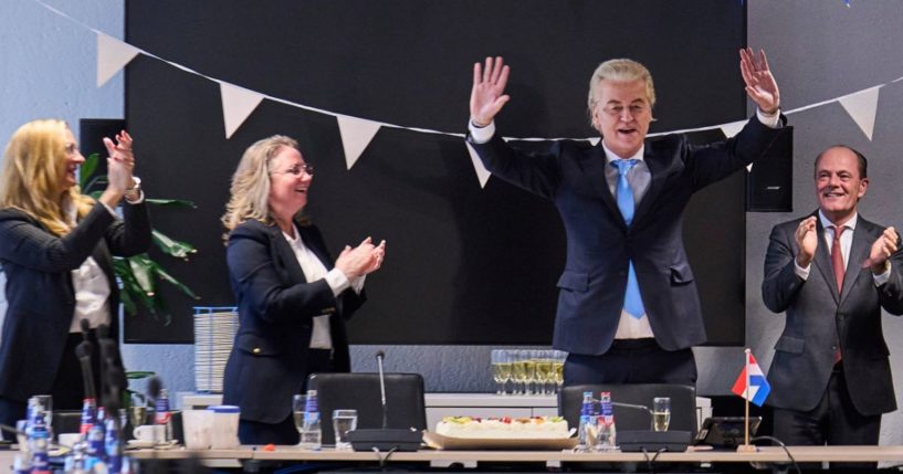 Party for Freedom leader Geert Wilders, second from right, celebrates with party members after winning the most votes in a general election at The Hague in the Netherlands on Thursday.