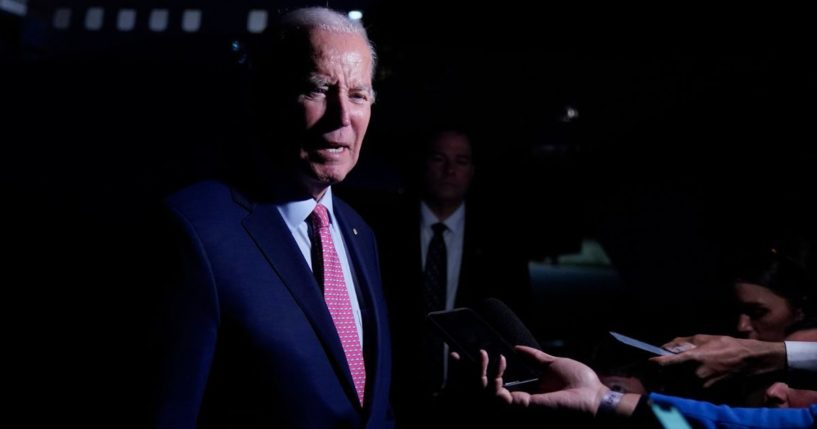 President Joe Biden speaks to members of the media before boarding Air Force One in Norfolk, Virginia, on Sunday.