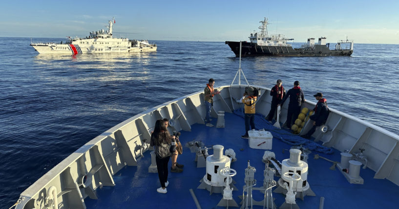 Chinese ships block the Philippine ship BRP Cabra during a mission in the South China Sea on Friday.