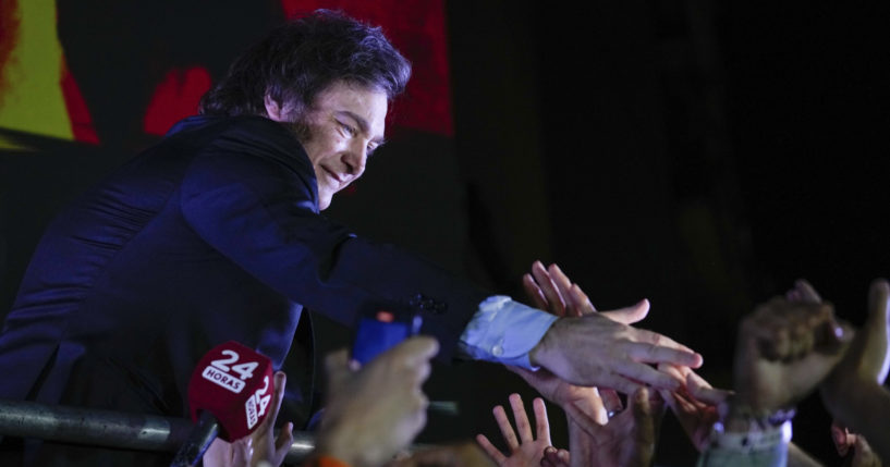 Javier Milei, presidential candidate of Argentina's Liberty Advances coalition greets supporters outside his campaign headquarters after winning the presidential runoff election in Buenos Aires on Sunday.