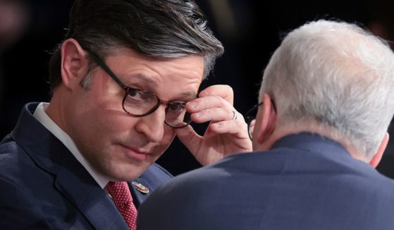 Newly elected Speaker of the House Rep. Mike Johnson (R-LA) speaks with Speaker pro tempore Patrick McHenry (R) (R-NC) in the House chamber after his election at the U.S. Capitol on October 25, 2023 in Washington, DC.