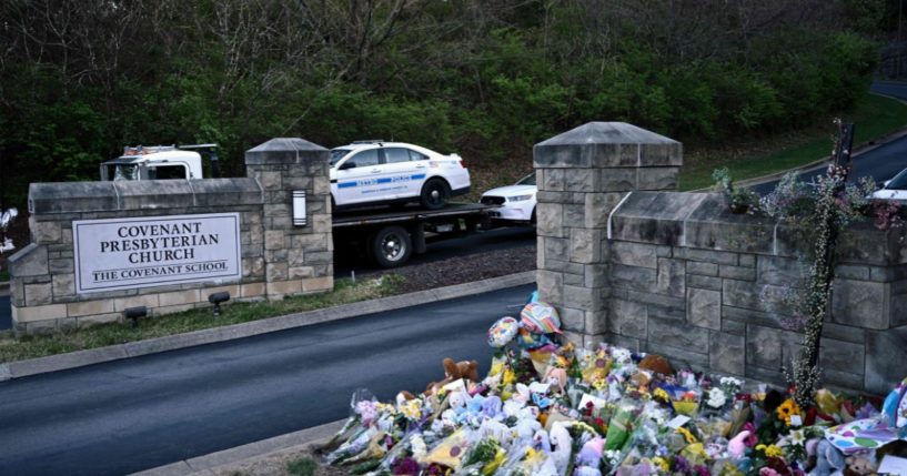 Police cars damaged during a shooting are removed from the Covenant School campus in Nashville, Tennessee, on March 28.