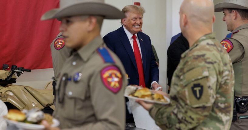 Former President Donald Trump serves meals to Texas Department of Public Safety (DPS) troopers at the South Texas International airport on November 19, 2023 in Edinburg, Texas.