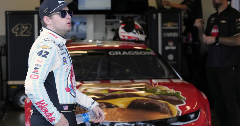 Noah Gragson stands by his car in his garage during a practice session for the NASCAR Daytona 500 auto race at Daytona International Speedway in Daytona Beach, Florida, on Feb. 17.