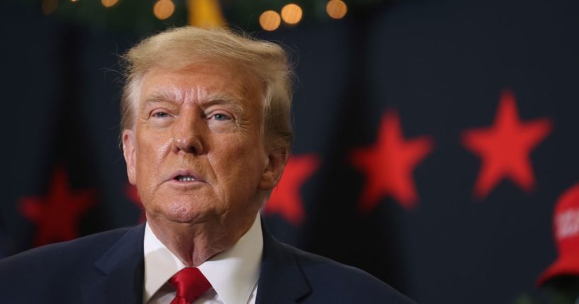 Former President Donald Trump looks on during a campaign event on Tuesday in Waterloo, Iowa.