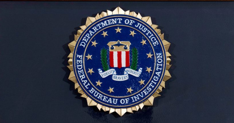 The FBI seal is displayed on a podium before a news conference at the agency's headquarters on June 14, 2018, in Washington, D.C.