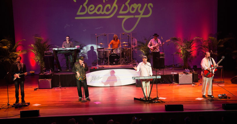 Scott Totten, Tim Bonhomme, Mike Love, John Cowsill, Bruce Johnston, Randell Kirsch, and Jeffery Foskett of The Beach Boys play at Ryman Auditorium on March 22, 2015, in Nashville, Tennessee.