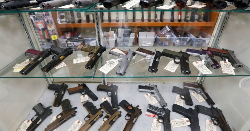 Semi-automatic handguns are displayed at a shop in New Castle, Pennsylvania. A federal judge on Friday struck down the Biden administration’s effort to ban adults between the ages of 18 and 20 from buying handguns.