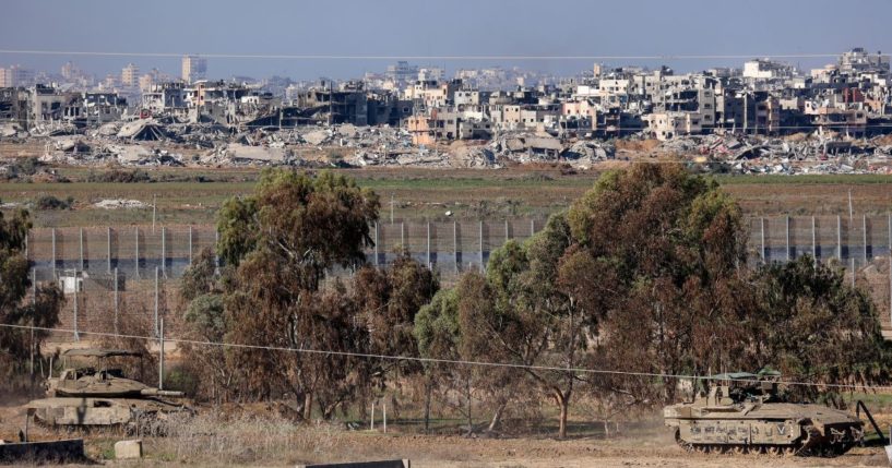 Israeli armored vehicles return from northern Gaza on Saturday amid ongoing battles between Israel and Hamas.