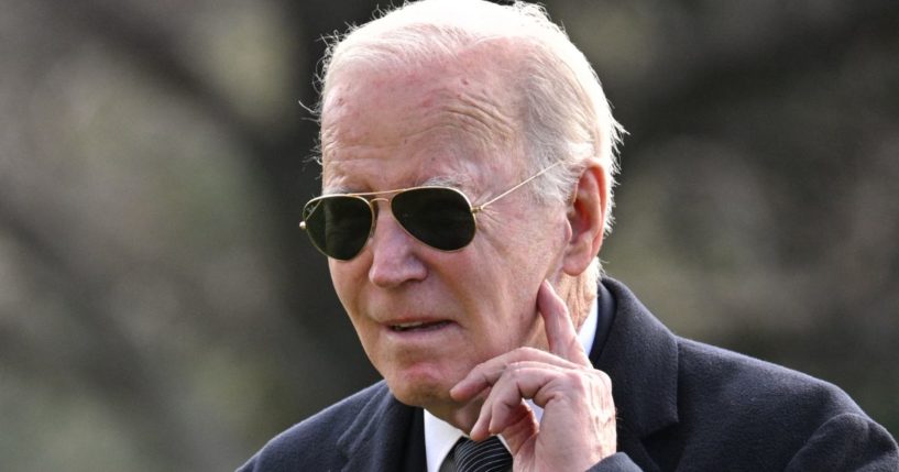 President Joe Biden listens to a question from the press as he arrives at White House in Washington, D.C., on Tuesday.