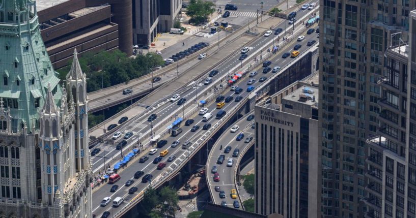 Vehicles move along a street in the Manhattan borough of New York City on July 24.