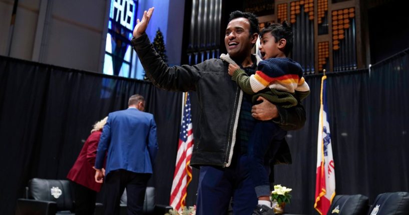 Republican presidential candidate and businessman Vivek Ramaswamy holds his son Karthik as he walks off stage during U.S. Rep. Randy Feenstra's Faith and Family with the Feenstras event, Saturday in Sioux Center, Iowa.