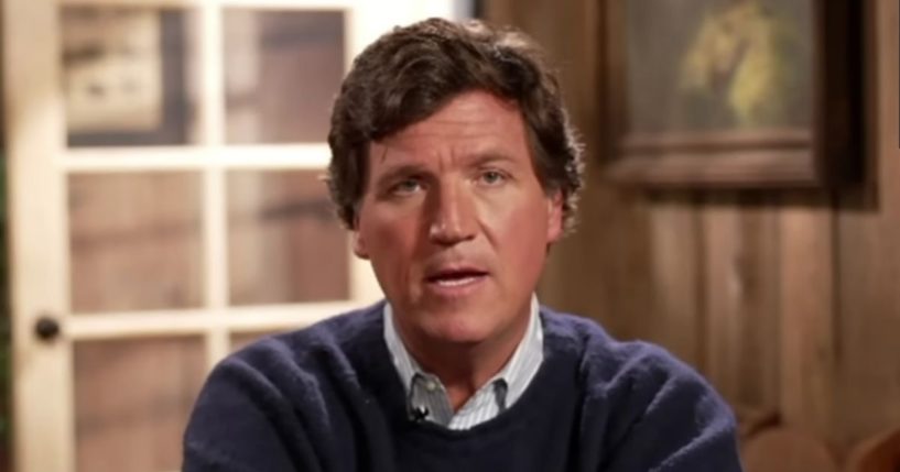 Tucker Carlson answering a question during an interview