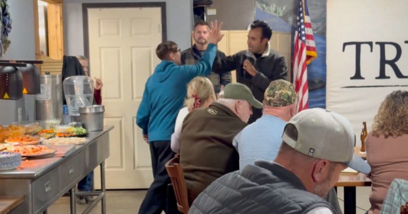 On Friday, an LGBT protester attended a campaign event in Iowa for Republican candidate Vivek Ramaswamy, right, who allowed her to speak.